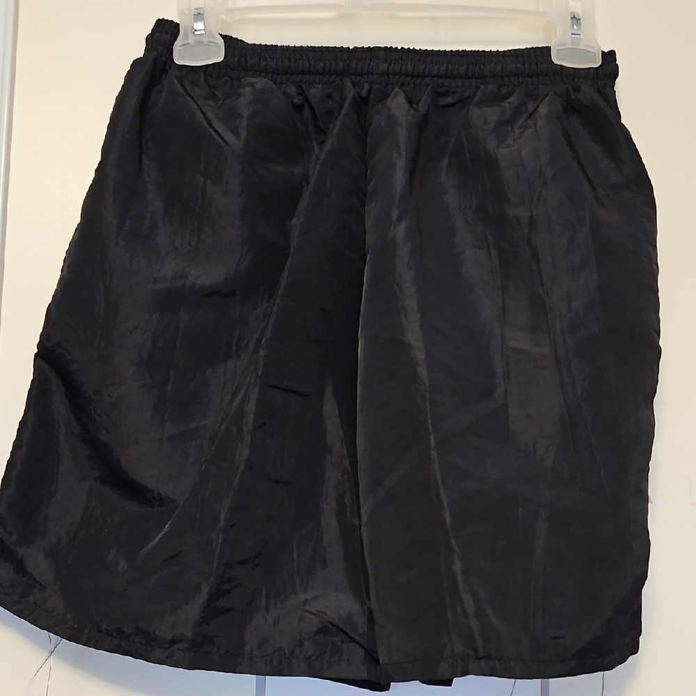 boys Black polyester nylon shorts with a sheen